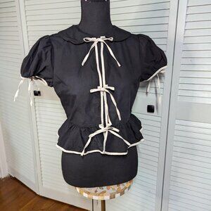 Sofie the Label black blouse with white ribbon bows